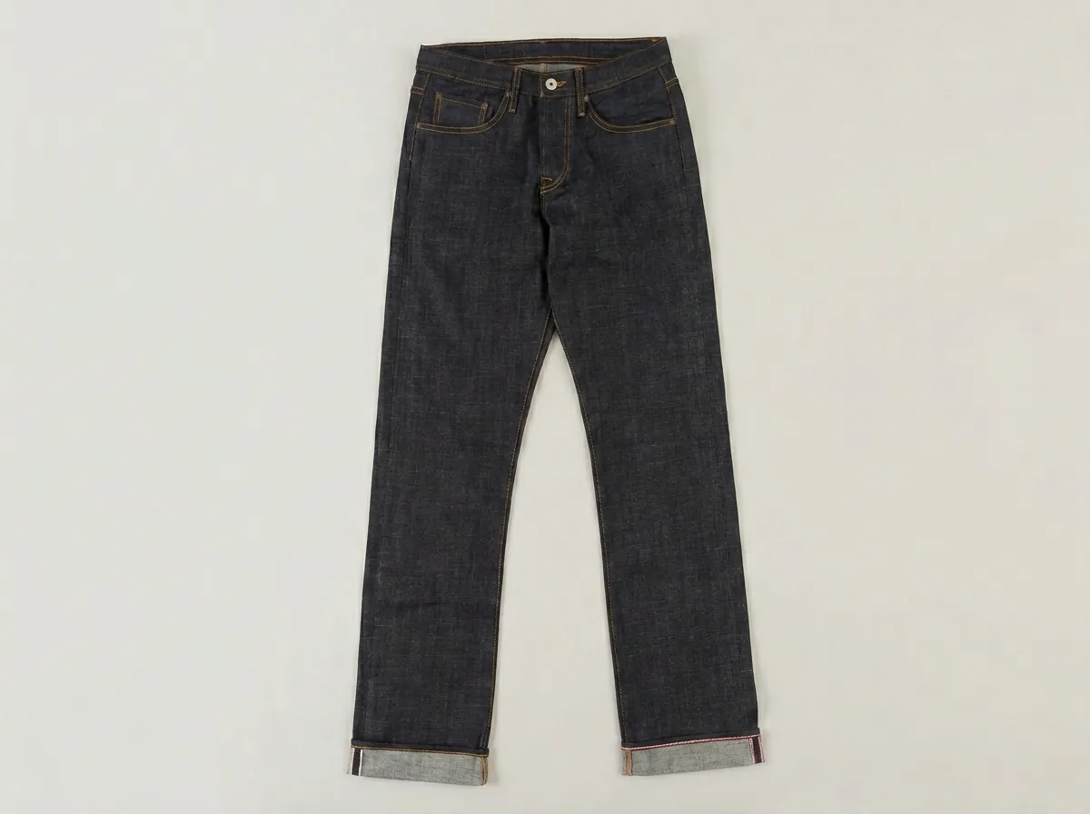Stronghold Original Fit raw indigo selvedge denim with spice stitching, cuffed